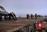 Image of Crews pushing FM-2 wildcat airplanes on escort carrier deck Iwo Jima, 1945, second 47 stock footage video 65675040329
