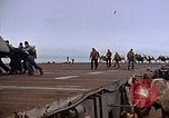 Image of Crews pushing FM-2 wildcat airplanes on escort carrier deck Iwo Jima, 1945, second 48 stock footage video 65675040329