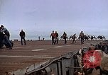 Image of Crews pushing FM-2 wildcat airplanes on escort carrier deck Iwo Jima, 1945, second 49 stock footage video 65675040329