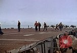 Image of Crews pushing FM-2 wildcat airplanes on escort carrier deck Iwo Jima, 1945, second 50 stock footage video 65675040329