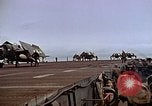 Image of Crews pushing FM-2 wildcat airplanes on escort carrier deck Iwo Jima, 1945, second 52 stock footage video 65675040329