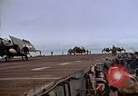 Image of Crews pushing FM-2 wildcat airplanes on escort carrier deck Iwo Jima, 1945, second 53 stock footage video 65675040329