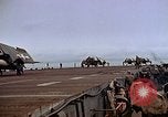 Image of Crews pushing FM-2 wildcat airplanes on escort carrier deck Iwo Jima, 1945, second 54 stock footage video 65675040329