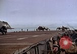 Image of Crews pushing FM-2 wildcat airplanes on escort carrier deck Iwo Jima, 1945, second 55 stock footage video 65675040329