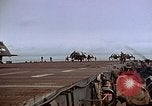 Image of Crews pushing FM-2 wildcat airplanes on escort carrier deck Iwo Jima, 1945, second 56 stock footage video 65675040329