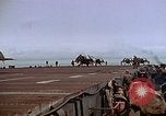 Image of Crews pushing FM-2 wildcat airplanes on escort carrier deck Iwo Jima, 1945, second 57 stock footage video 65675040329
