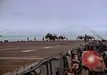 Image of Crews pushing FM-2 wildcat airplanes on escort carrier deck Iwo Jima, 1945, second 58 stock footage video 65675040329