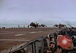 Image of Crews pushing FM-2 wildcat airplanes on escort carrier deck Iwo Jima, 1945, second 59 stock footage video 65675040329