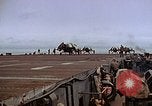 Image of Crews pushing FM-2 wildcat airplanes on escort carrier deck Iwo Jima, 1945, second 60 stock footage video 65675040329