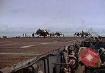 Image of Crews pushing FM-2 wildcat airplanes on escort carrier deck Iwo Jima, 1945, second 61 stock footage video 65675040329