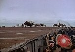 Image of Crews pushing FM-2 wildcat airplanes on escort carrier deck Iwo Jima, 1945, second 62 stock footage video 65675040329