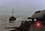 Image of Mail and personnel transfer between escort carrier and destroyer escor Pacific Ocean, 1945, second 26 stock footage video 65675040330