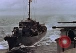 Image of Mail and personnel transfer between escort carrier and destroyer escor Pacific Ocean, 1945, second 32 stock footage video 65675040330