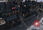 Image of Mail and personnel transfer between escort carrier and destroyer escor Pacific Ocean, 1945, second 42 stock footage video 65675040330