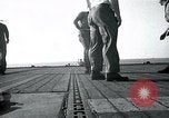 Image of US Navy TBM aircraft landing on carrier Pensacola Florida USA, 1945, second 28 stock footage video 65675040337
