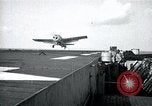 Image of US Navy TBM aircraft landing on carrier Pensacola Florida USA, 1945, second 35 stock footage video 65675040337