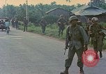 Image of US Army soldiers in field Vietnam, 1968, second 7 stock footage video 65675040364