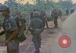 Image of US Army soldiers in field Vietnam, 1968, second 18 stock footage video 65675040364