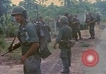 Image of US Army soldiers in field Vietnam, 1968, second 19 stock footage video 65675040364