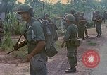 Image of US Army soldiers in field Vietnam, 1968, second 20 stock footage video 65675040364