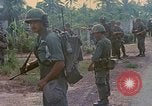 Image of US Army soldiers in field Vietnam, 1968, second 21 stock footage video 65675040364