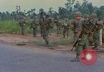 Image of US Army soldiers in field Vietnam, 1968, second 26 stock footage video 65675040364