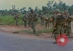 Image of US Army soldiers in field Vietnam, 1968, second 27 stock footage video 65675040364