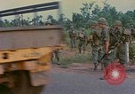 Image of US Army soldiers in field Vietnam, 1968, second 33 stock footage video 65675040364