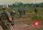 Image of US Army soldiers in field Vietnam, 1968, second 34 stock footage video 65675040364