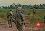 Image of US Army soldiers in field Vietnam, 1968, second 35 stock footage video 65675040364