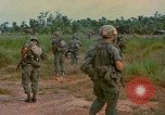 Image of US Army soldiers in field Vietnam, 1968, second 36 stock footage video 65675040364