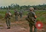 Image of US Army soldiers in field Vietnam, 1968, second 37 stock footage video 65675040364