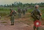 Image of US Army soldiers in field Vietnam, 1968, second 39 stock footage video 65675040364
