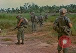 Image of US Army soldiers in field Vietnam, 1968, second 40 stock footage video 65675040364