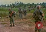 Image of US Army soldiers in field Vietnam, 1968, second 42 stock footage video 65675040364