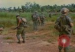 Image of US Army soldiers in field Vietnam, 1968, second 43 stock footage video 65675040364
