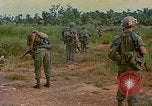 Image of US Army soldiers in field Vietnam, 1968, second 44 stock footage video 65675040364