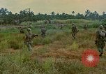 Image of US Army soldiers in field Vietnam, 1968, second 45 stock footage video 65675040364