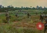 Image of US Army soldiers in field Vietnam, 1968, second 46 stock footage video 65675040364