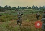 Image of US Army soldiers in field Vietnam, 1968, second 48 stock footage video 65675040364