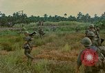 Image of US Army soldiers in field Vietnam, 1968, second 49 stock footage video 65675040364