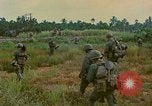 Image of US Army soldiers in field Vietnam, 1968, second 50 stock footage video 65675040364