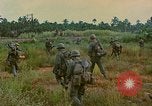 Image of US Army soldiers in field Vietnam, 1968, second 51 stock footage video 65675040364