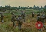 Image of US Army soldiers in field Vietnam, 1968, second 52 stock footage video 65675040364