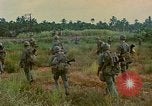 Image of US Army soldiers in field Vietnam, 1968, second 53 stock footage video 65675040364