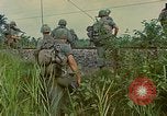 Image of US Army soldiers in field Vietnam, 1968, second 54 stock footage video 65675040364