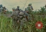 Image of US Army soldiers in field Vietnam, 1968, second 56 stock footage video 65675040364