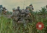 Image of US Army soldiers in field Vietnam, 1968, second 57 stock footage video 65675040364