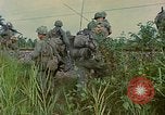 Image of US Army soldiers in field Vietnam, 1968, second 58 stock footage video 65675040364