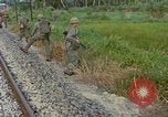 Image of US Army soldiers in field Vietnam, 1968, second 59 stock footage video 65675040364